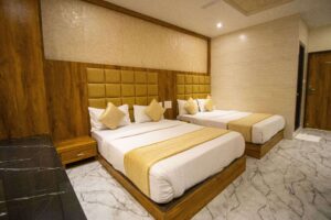 Another angle of the spacious quadruple room, emphasizes its comfortable layout and stylish decor.